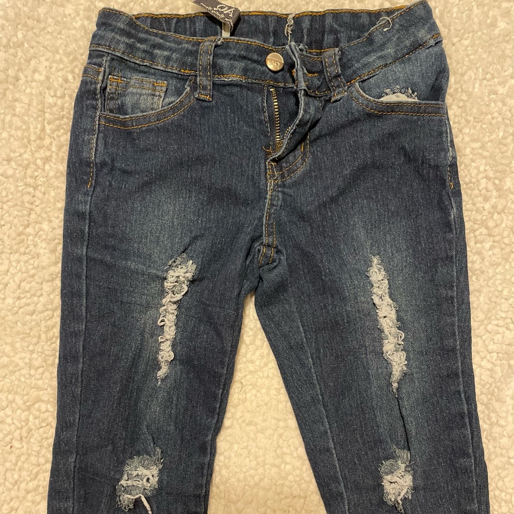 Girls dark blue jeans with rips